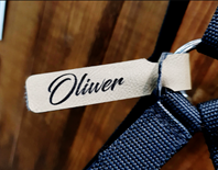 Lädertag med lasergraverad text. 125x20mm